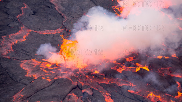 Lava bursts out of the worlds largest lava lake inside Nyiragongo in the Democratic Republic of Congo. Taken 500 metres inside the active volcano.
