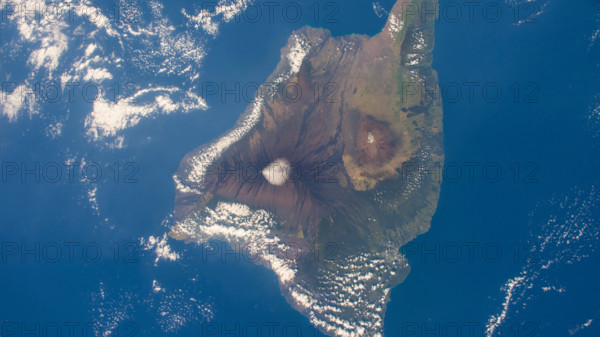 Aerial of the big island of Hawaii showing Kilauea, Mauna Loa, and Mauna Kea.