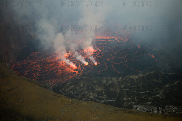 An active lava lake churns in the crater of Mount Nyiragongo Volcano, Kibati, Virunga National Park, Democratic Republic of Congo (DRC).