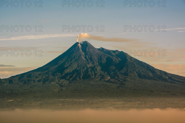 beauty of sunrise merapi mountain, indonesia. Mount Merapi is one of the most active mountains in Indonesia