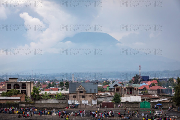 The city of Goma, Democratic Republic of Congo, with Nyiragongo volcano in the distance