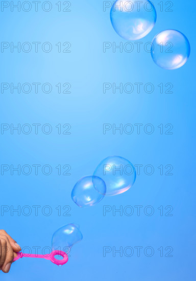 Soap bubbles on blue background