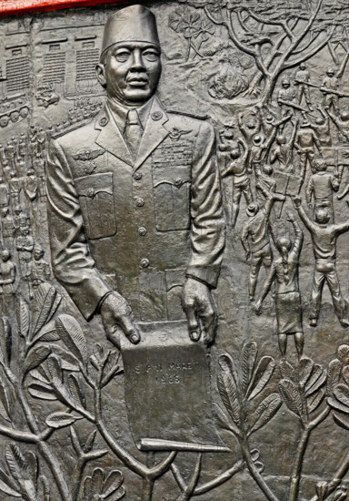 jakarta, dki jakarta/indonesia - april 20, 2009: detail of the relief at pancasila sakti memorial site, sukarno holding spersemar