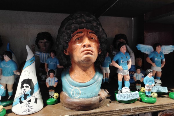 Naples, Italy December 2020: Diego Armando Maradona, the most important Football Player, repeated in the art of Neapolitan nativity of S. Gregorio Armeno.