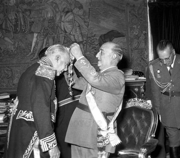 Dominican dictator Rafael Trujillo (left) is presented with an award by Spanish dictator Francisco Franco, 1954. The two tyrants were close friends and allies, and upon Trujillo's overthrow his son Ramfis was given refuge in Spain.