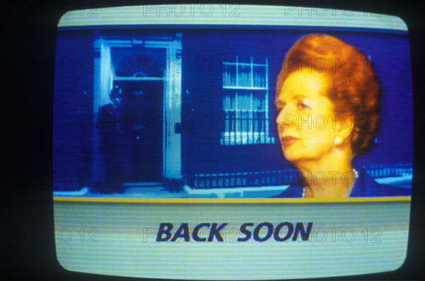 Mrs Margaret Thatcher as seen on ITN news, her resignation on 22 11 1990. Image 10 Downing Street background. Inset portrait of the Prime Minister, commercial advertising beak  "Back Soon". 1990 1990s UK HOMER SYKES