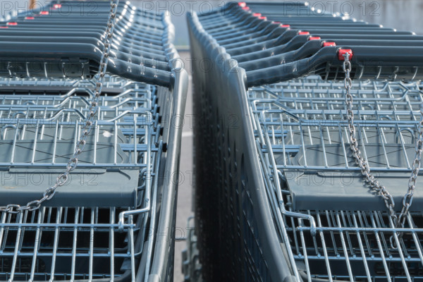 Wire modern supermarket shopping cart, symbol of consumerism in france