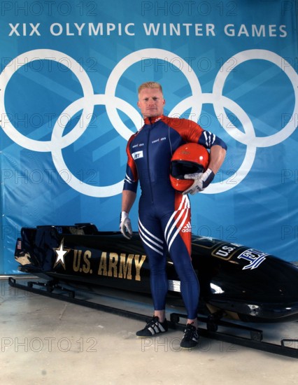 World Class Athlete SPECIALIST (SPC) (E-4) Douglas Sharp, USA, poses with a four-man bobsled. SPC Sharp and his team members won the Bronze medal at the XIX OLYMPIC WINTER GAMES at the Utah Olympic Park in Park City, Utah, during the 2002 games. Subject Operation/Series: XIX OLYMPIC WINTER GAMES Base: Salt Lake City State: Utah (UT) Country: United States Of America (USA)