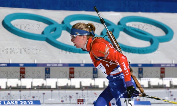 Competing in the Biathlon event, World class athlete SPECIALIST Andrea Nahrgang, USA, passes the shooting range, with her .22 caliber, bolt-action rifle slung on her back, at Soldier Hollow during the women's 4 X 7.5km Relay competition in the 2002 OLYMPIC WINTER GAMES. The Relay competition consists of four team members; each must ski 7.5 km, with two firing bouts, one prone and one standing, each bout with unsupported rifle. Team USA would finish the race in 15th place, 13:21.0 behind the leader. Subject Operation/Series: 2002 OLYMPIC WINTER GAMES Base: Salt Lake City State: Utah (UT) Countr
