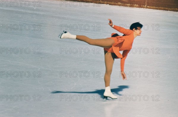 1960 Winter Olympics in Squaw Valley California: Female figure skater practicing her routine on the west rink