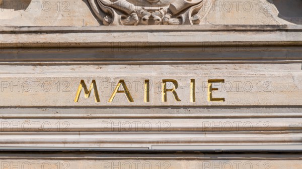 Sign saying 'Town hall' written in French on the facade of a city hall. Concepts of municipal elections, local politics and administration in France