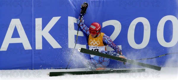 Feb. 13, 2002 - U.S. - KRT SPORTS STORY SLUGGED: OLY-ALPINE-COMBINED KRT PHOTOGRAPH BY JERILEE BENNETT/COLORADO SPRINGS GAZETTE (February 13) SNOWBASIN, UT--  USA's P. Casey Puckett, slides into the barrier at the end of the men's combined slalom skiing event at the Salt Lake City Winter Olympic Games in Snowbasin, Utah Wednesday February 13, 2002. (GT) BL NC KD 2002 (Horiz) (lde) (Credit Image: © Colorado Springs Gazette/mct/ZUMAPRESS.com)