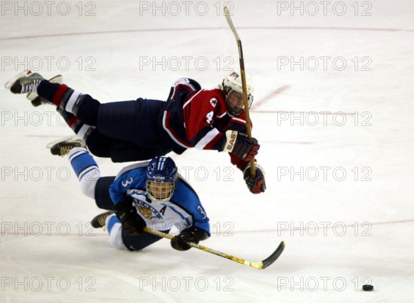 Feb. 16, 2002 - U.S. - NO MAGS, NO SALES -- (KRT101) KRT SPORTS STORY SLUGGED: OLY-HOCKEY KRT PHOTOGRAPH BY DAMON WINTER/DALLAS MORNING NEWS (February 16) SALT LAKE CITY, UT-- USA's Angela Ruggiero (top) goes airborne in pursuit of the puck over Finland's Emma Laaksonen in the first period of the women's preliminary round group B ice hockey game at the Salt Lake 2002 Winter Olympic Games in Salt Lake City, February 16, 2002. The U.S. won 5-0. (DA) AP NC KD BL 2002 (Horiz) (lde) (Additional photos available on KRT Direct, KRT/NewsCom or upon request) (Credit Image: © Dallas Morning News/mct/ZUM