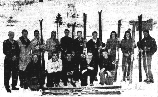 The Canadian national team at the 1948 Winter Olympics in St. Moritz. The team members are shown standing and kneeling in this historical photograph from the Games.