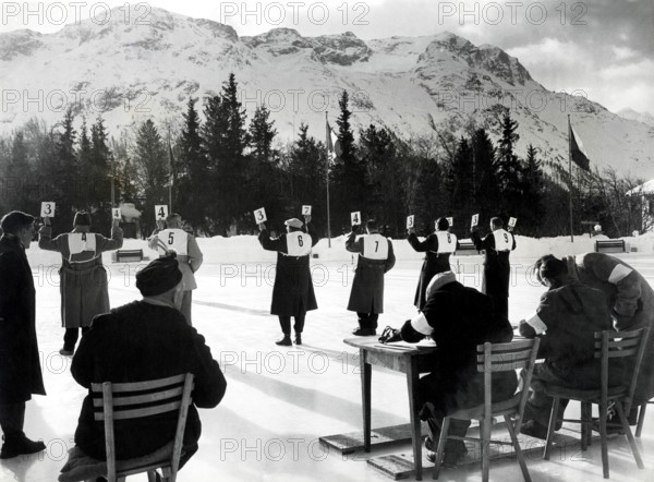 Jan 31, 1948; St. Moritz, SWITZERLAND; Judges hold up the score cards while judging in the Women's Singles Skating Championships during the 1948 St. Moritz Winter Olympics. (Credit Image: © KEYSTONE Pictures USA)