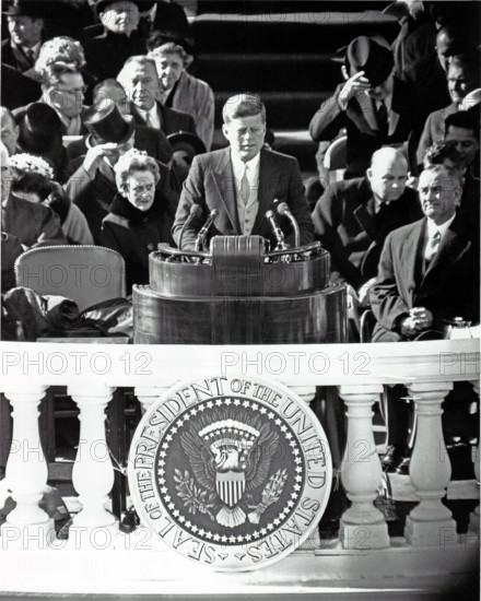 United States President John F. Kennedy delivers his Inaugural Address after being sworn-in as the 35th President of the United States on the East Front of the U.S. Capitol in Washington, D.C. on Friday, January 20, 1961.  U.S. Vice President Lyndon B. Johnson looks on from right..Credit: Arnie Sachs / CNP /MediaPunch