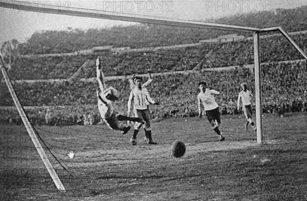 A historical moment from the 1930 FIFA World Cup, capturing the moment Uruguay scored against Argentina. The match is one of the significant moments in early World Cup history.