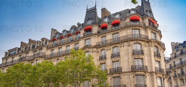 Eiffel tower between Parisian tenement old street alley and buildings, Paris