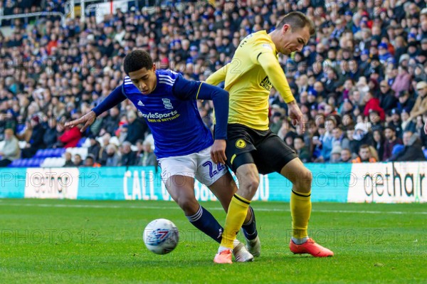 Birmingham, UK. 30th Nov, 2019.  Jude Bellingham of Birmingham City battling with Jake Cooper of Millwall during the Sky Bet Championship match between Birmingham City and Millwall at St Andrews, Birmingham on Saturday 30th November 2019. (Credit: Alan Hayward | MI News) Photograph may only be used for newspaper and/or magazine editorial purposes, license required for commercial use Credit: MI News & Sport /Alamy Live News