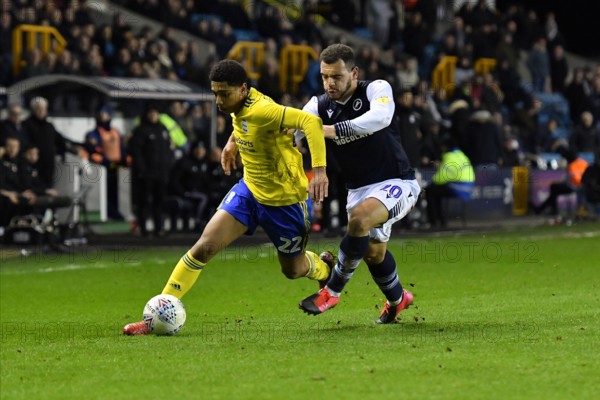 LONDON, ENGLAND - FEBRUARY 26TH Jude Bellingham of Birmingham battles for possession with Mason Bennett of Millwall during the Sky Bet Championship match between Millwall and Birmingham City at The Den, London on Wednesday 26th February 2020. (Credit: Ivan Yordanov | MI News)Photograph may only be used for newspaper and/or magazine editorial purposes, license required for commercial use Credit: MI News & Sport /Alamy Live News