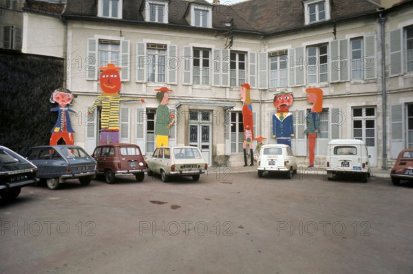 Renault & Citroen cars parked in a square in Auxerre, France in 1973