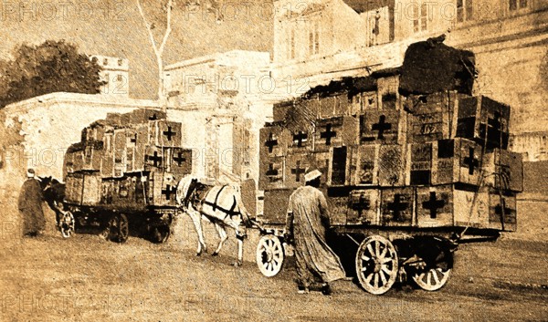 WWI- An old wartime printed photograph of  Red Cross supplies being transported to the Anzac hospital at Alexandria.  In the Gallipoli campaign, many troops were transported to  hospitals in Egypt and Malta.