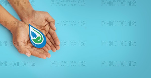 Hands holding clean water drop,world water day, washing hands, save water, clean renewable energy, flood disaster relief concept