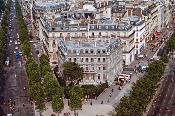 View from the top of the Arc de Triomphe in Paris with the Avenues De Friedland and Charles de Gaulle. Pedestrians crossing busy roads.  Archival shot