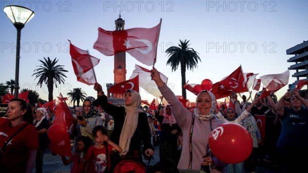 Turkey. 15th July, 2022. People with Turkish flags , some of them with President Erdogan and Ottoman flag attended July 15 Democracy and National Unity Day's events to mark July 15 defeated coup's anniversary at Konak Square. 249 people were martyred and nearly 2,200 people injured in the defeated 15th of July 2016 coup attempt. Credit: Idil Toffolo/Alamy Live News