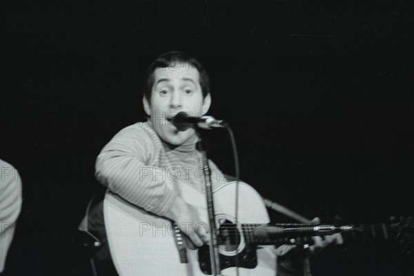 June 17, 1967, Monterey, California, USA - PAUL SIMON performs with Simon & Garfunkle during the Monterey International Pop Music Festival. The festival was a three-day concert event held June 16 to June 18, 1967 at the Monterey County Fairgrounds. Jill Gibson was an experienced photojournalist by 1967 and the Official Photographer for The Monterey Pop Festival. These are her images, many of which have never been released prior to now, in commemoration of the 50th Anniversary of Monterey Pop. (Credit Image: © Jill Gibson/ZUMA Press Wire Service)