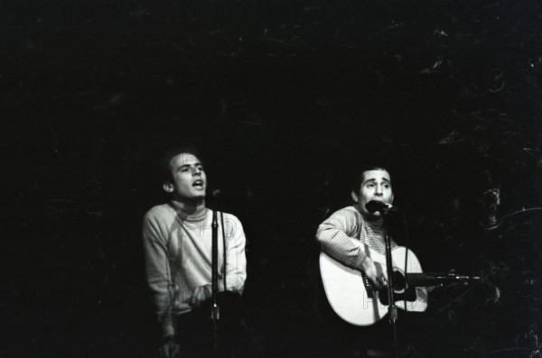 June 17, 1967, Monterey, California, USA - ART GARFUNKLE, left, and PAUL SIMON, right, perform as Simon & Garfunkle during the Monterey International Pop Music Festival. The festival was a three-day concert event held June 16 to June 18, 1967 at the Monterey County Fairgrounds. Jill Gibson was an experienced photojournalist by 1967 and the Official Photographer for The Monterey Pop Festival. These are her images, many of which have never been released prior to now, in commemoration of the 50th Anniversary of Monterey Pop. (Credit Image: © Jill Gibson/ZUMA Press Wire Service)