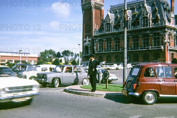 A gendarme controlling traffic in Calais, France, in 1968