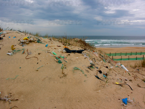 trash rubbish on dunes at the beach of Atlantic Ocean in France