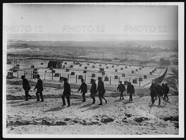 Dominion journalists visited a messenger dog depot in France during World War I. These dogs were vital for carrying messages between units, helping maintain communication in the field under challenging conditions.