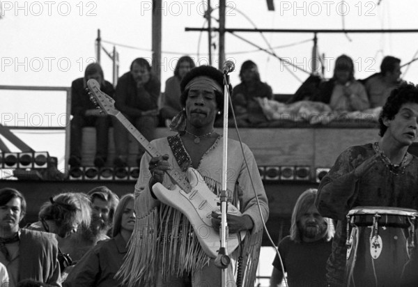 Jimi Hendrix performing his legendary 2 hour performance at Woodstock Music & Arts Festival held on Sam Yasgur's alfalfa field in Sullivan County in Bethal, New York on August 18, 1969. Hendrix insisted he close the festival and was scheduled to appear at midnight but due to delays did not take the stage until 9 am Monday morning. Most of the crowd had left for home by then and had dwindled from a whopping 500,000 to measly 80,000.© Peter Tarnoff / MediaPunch