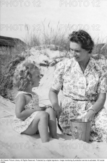 Princess Sibylla of Saxe-Coburg and Gotha (Sibylle Calma Marie Alice Bathildis Feodora 18 January 1908 – 28 November 1972) was a member of the Swedish royal family and the mother of the current king of Sweden, Carl XVI Gustaf. Pictured together with her daughter princess Birgitta on the beach at Falsterbo 21 juli 1940.