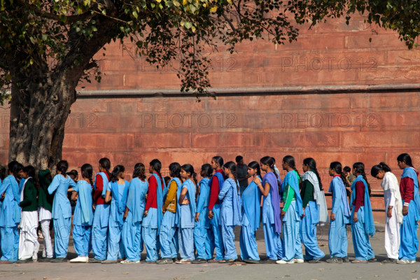 Muslim teenager girls wearing blue school uniforms in Old Delhi, India