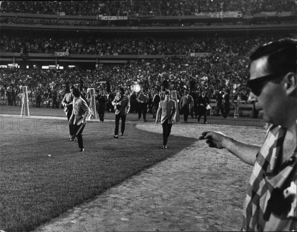 Aug. 08, 1966 - Never before have entertainers used a stadium which normally holds 60,000 plus sportsfans, but when the Beatles went to now America only the largest stage available would do, so they rented the Shea stadium, New York. And they filled it right up to every available seat. There the famous four confronts their audience - a howling, shrieking waving ecstatic mob of bos and girls and some not so young came to pay homage to the greatest of the pop singers. (Credit Image: © Keystone Press Agency/Keystone USA via ZUMAPRESS.com)