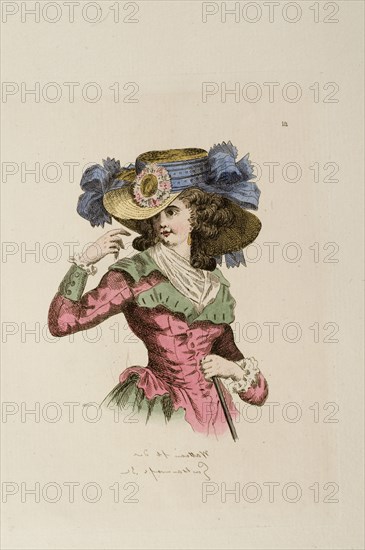 Woman wearing hat with sunflower