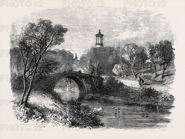 THE AULD BRIG OF DOON, WITH BURNS' MONUMENT AND A GLIMPSE OF ALLOWAY KIRK IN THE DISTANCE, THE BURNS CENTENARY