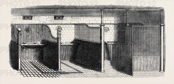 STABLE FITTINGS BY MESSRS. MUSGRAVE BROTHERS, OF BELFAST; OPEN STALL, WITH PATENT SLIDING BARRIER (LEFT), OPEN STALL, WITH TUMBLING MANGER (CENTRE), HARMLESS LOOSE-BOX (RIGHT), THE INTERNATIONAL EXHIBITION, 1862