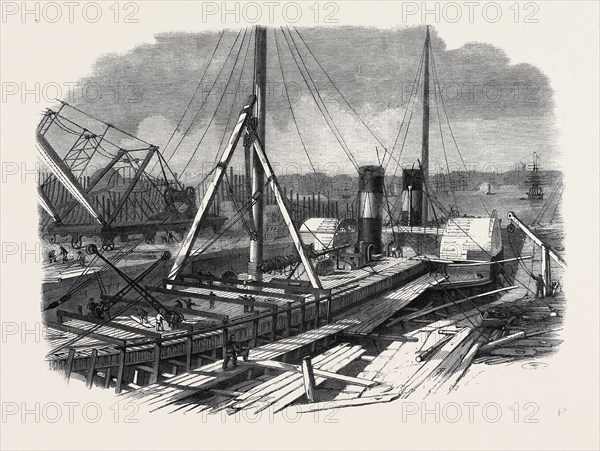 LAIRD'S GRAVING DOCKS AT BIRKENHEAD: THE HIBERNIA UNDER REPAIR