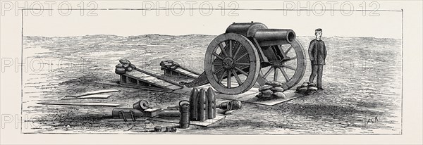 "SIEGE GUNS AND EARTHWORKS", ARTILLERY EXPERIMENTS AT EASTBOURNE: A 46 CWT. HOWITZER ON ITS PLATFORM, WITH TEMPORARY EXPEDIENT OF INCLINED PLANKS