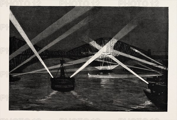 THE NAVAL MANOEUVRES, WITH THE NORTHERN FLEET: THE SHIPS SEARCHING THE FORTH BRIDGE WITH THE ELECTRIC LIGHT