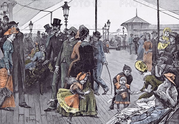 Near the sea in 1885, Britain, sea breeze; holiday; break; cheerful; merry; jolly; pleasant; merrymaking; treat; big time; recreation; play; fashion; hats; spade bucket; promenade; walking stick; chattering; canvas;