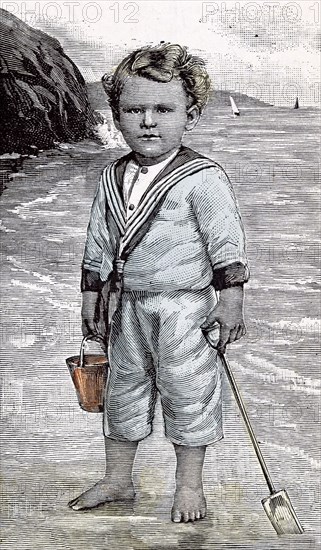 Hazeldean, Kingston, Jamaica, 1891. Boy at the seaside, summertime; beach; spade and bucket; play; holiday; joy; sea, water