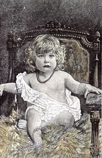 Girl in a chair, Hackney, London, 1892, childhood, at home; family; chair; armchair; overstuffed chair; dreaming; day dreaming; observant; fancy; admiration; interest; anticipation;