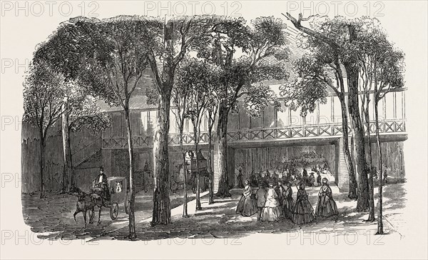 Expo 1855. Walkway of the Rotunda Annex, above the Cours-la-Reine. Paris, France, Exposition universelle. An international Exhibition held on the Champs-Elysees in 1855, consisting of an industrial and an beaux Arts exposition. Engraving