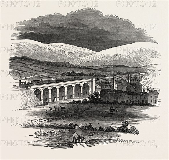 OPENING OF THE LANCASTER AND CARLISLE RAILWAY: BRIDGE OVER THE LUNE, FROM THE CHURCHYARD, LANCASTER, UK, 1846