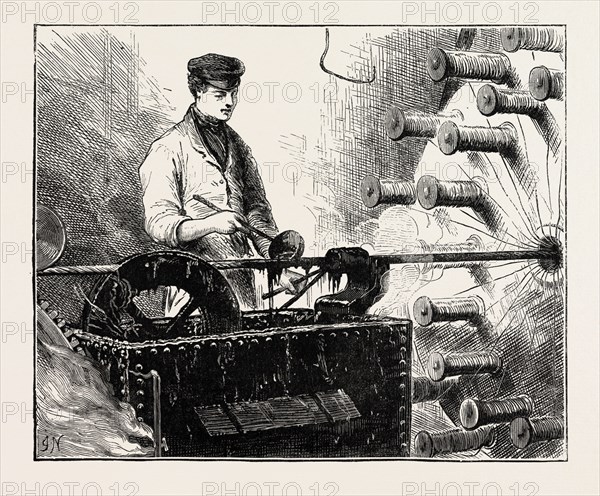 MANUFACTURING AN ELECTRIC TELEGRAPH CABLE: COVERING THE CABLE WITH JUTE AND TAR, 1873